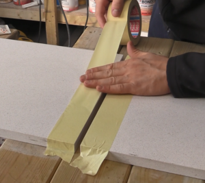 Protecting stone worktop joint and surface with masking tape