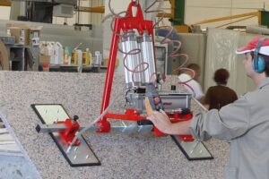 Elephant Vacuum Pad Lifter lifting piece of stone in fabrication workshop
